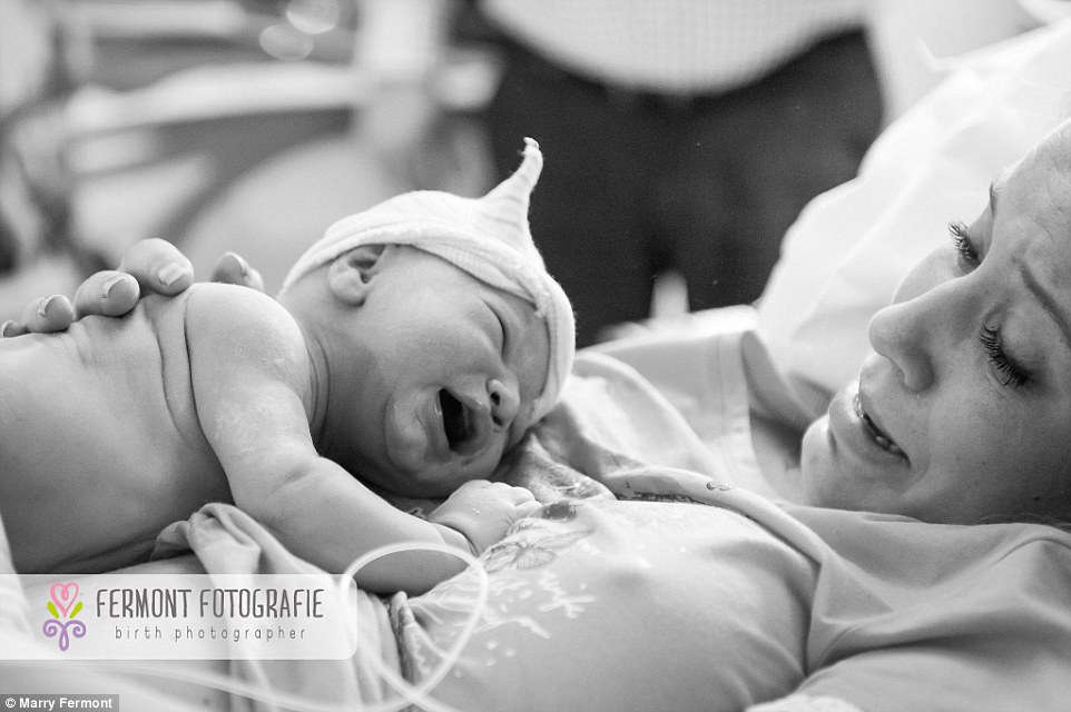 Both mum and baby shed a few tears as they meet for the first time. Marry, who has photographed 105 births, says that every single one is magical
